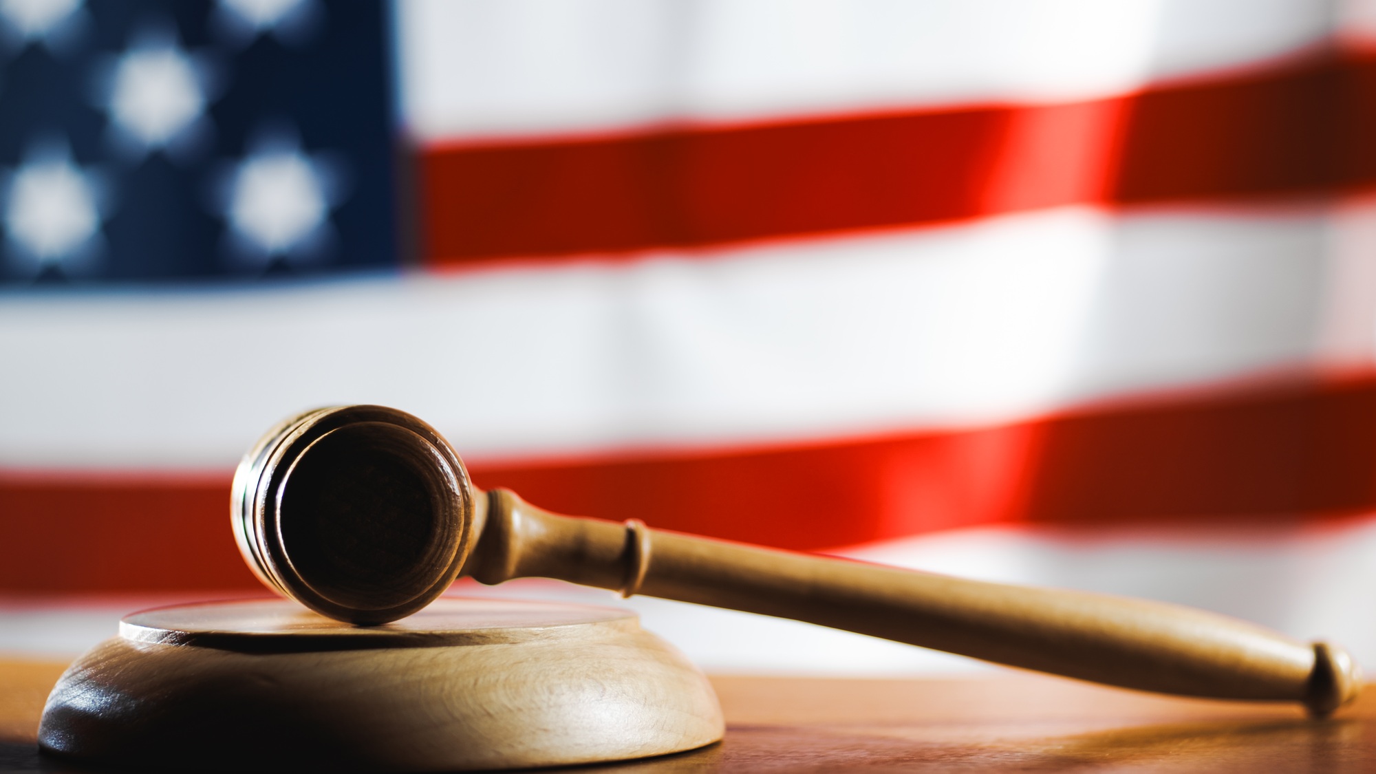 American law symbol with hammer and US flag